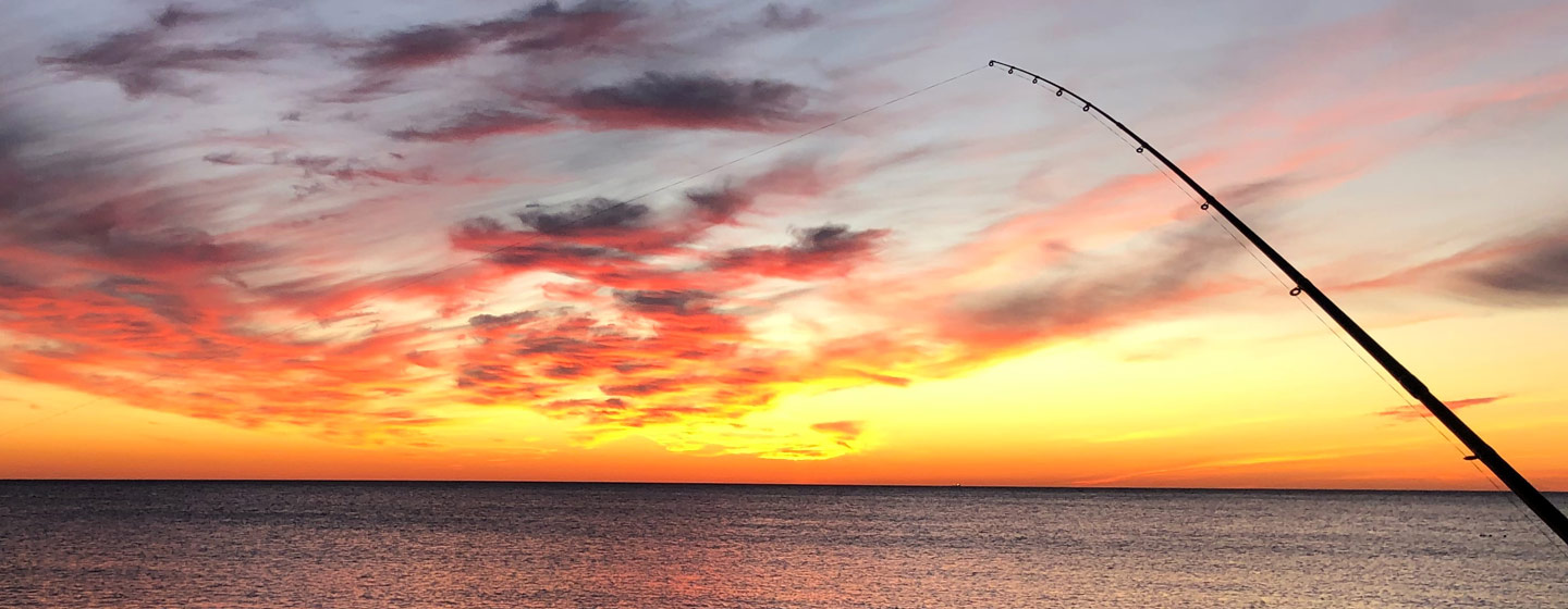 Fiskespö i solnedgång